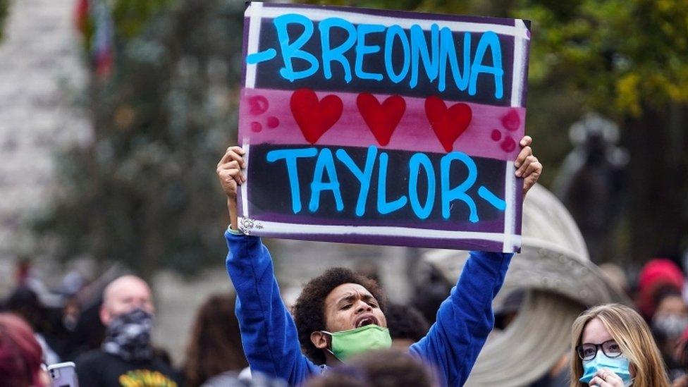 protestor-with-breonna-taylor-sign.