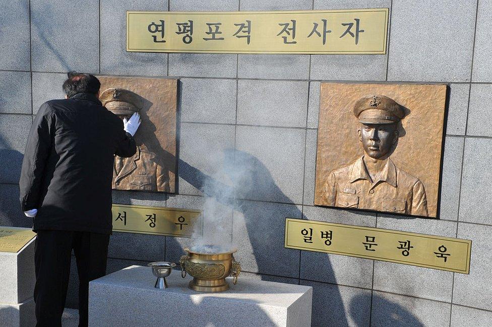 Image of mourner at the South Korean memorial for those killed in the 2010 Yeonpyeong incident