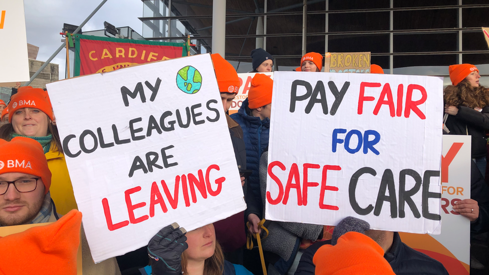 Junior doctors gathered outside the Senedd in Cardiff Bay on Tuesday