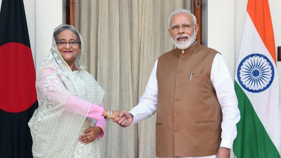 India's Prime Minister Narendra Modi (R) shakes hands with Bangladesh's Prime Minister Sheikh Hasina prior to a meeting in New Delhi on October 5, 2019