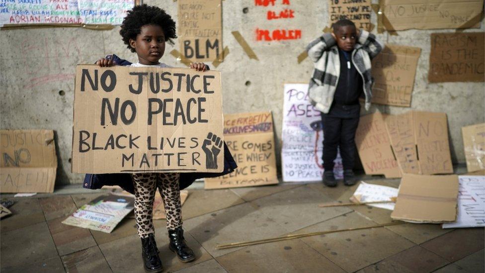 Children joined thousands of protestors in Manchester, England