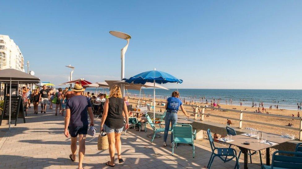 Saint-Gilles-Croix-de-Vie (central-western France): holidaymakers on the embankment and the main beach, on the coast of the Vendee department.