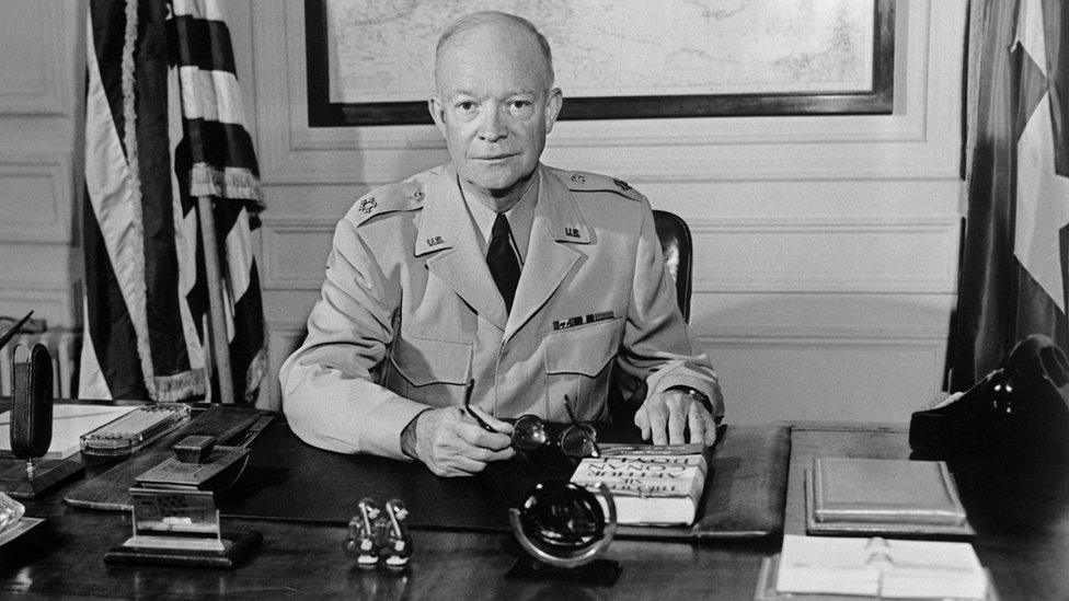 The former Commander in chief of the Allied forces in Europe (1943) and the future US President General Dwight David "Ike" Eisenhower (1890-1969) poses for a photographer in 1951 at NATO Paris headquarters