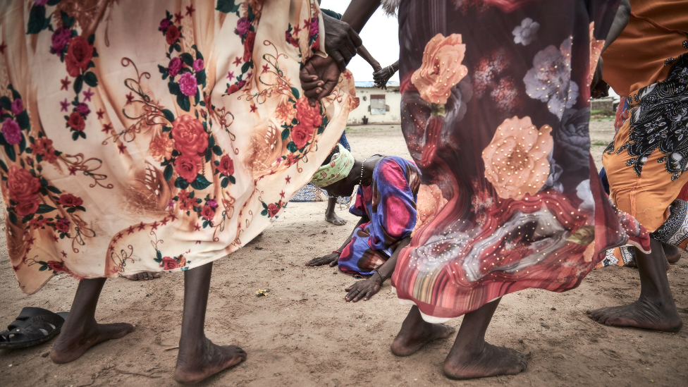 Women dancing and celebrating the removal of mines by the UN in Canal Village, Jonglei state, South Sudan