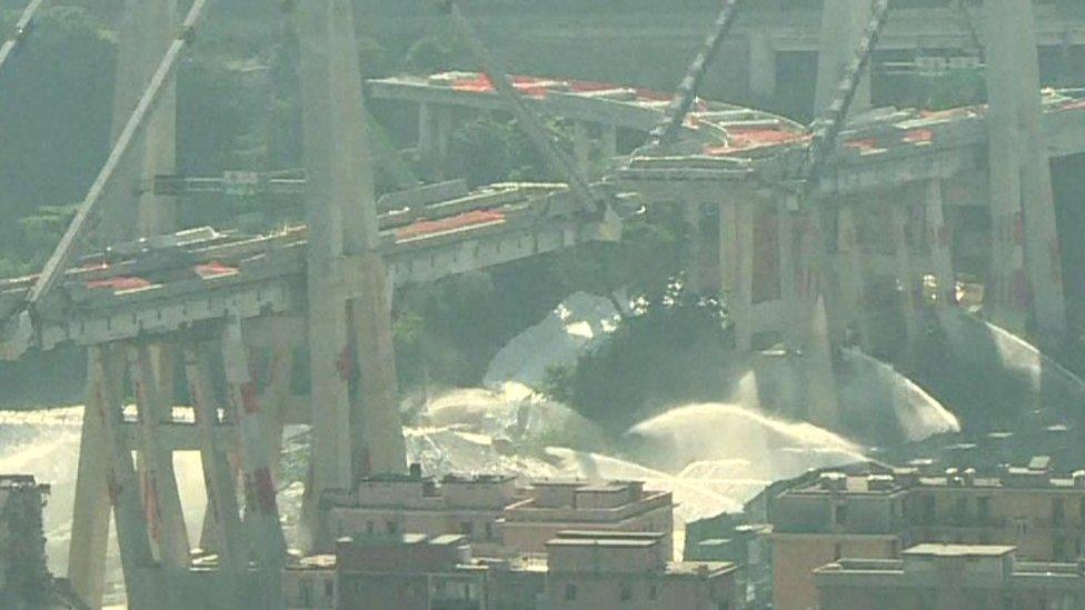 Fountains of water sprayed the base of the structure before the blasts