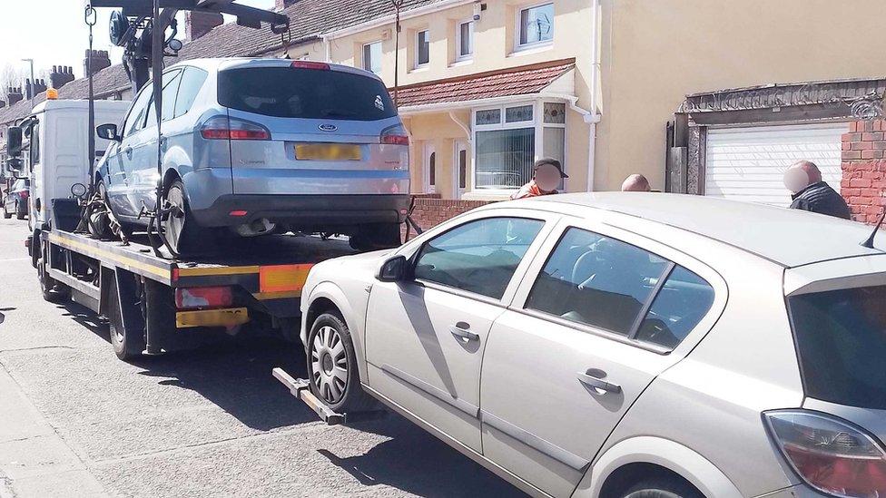 Car being towed away