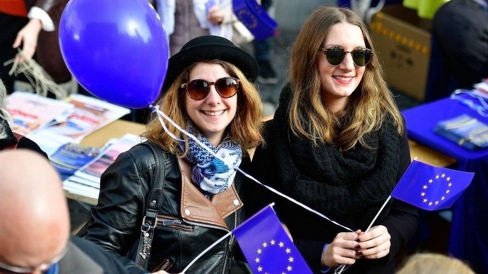 Young women waving flags of the European Union gather in the city centre for a pro-EU demonstration of the 'Pulse of Europe' movement on March 12, 2017 in Frankfurt, Germany. The movement sprung up in 2016 after the Brexit referendum result and the election of U.S. President Donald Trump