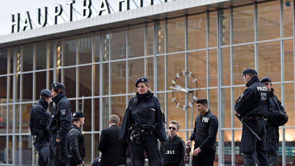 Police officers in front of train station