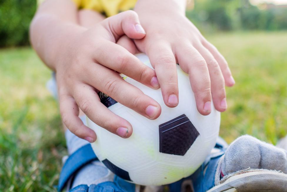 Child playing with a ball