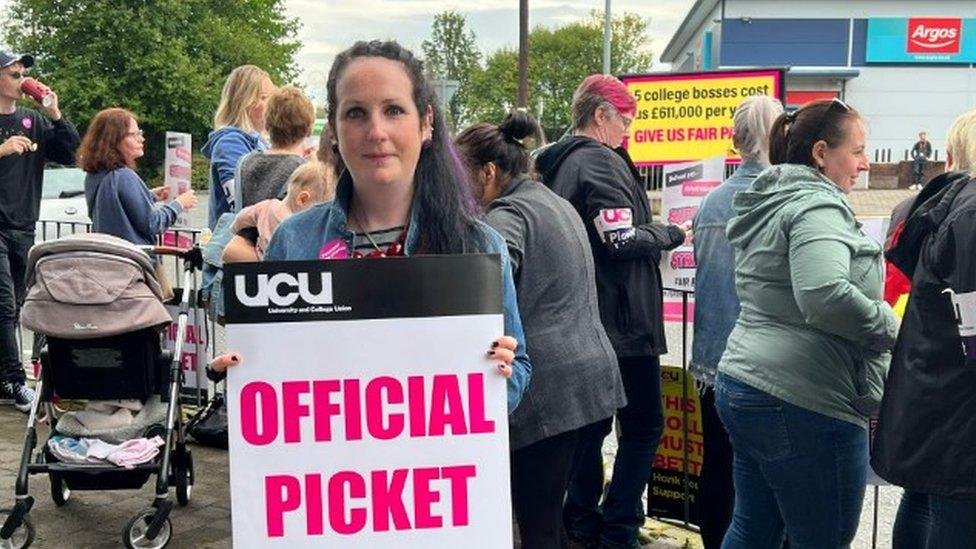 UCU president Janet Farrar holding picket line poster at Burnley College