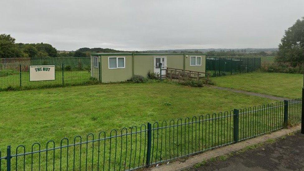 The existing pre-fab hut