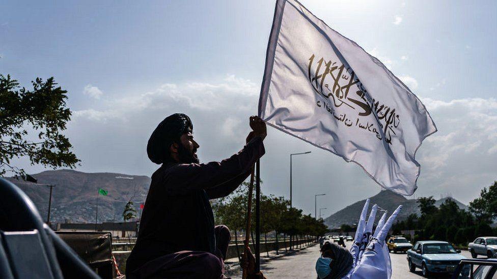 Man raises flag