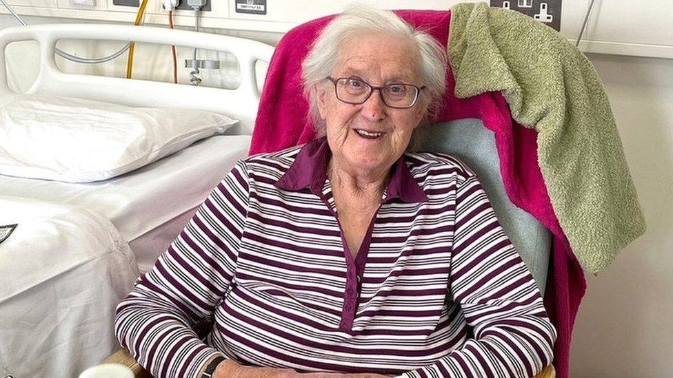 Gwendaline Bawden sitting next to her hospital bed