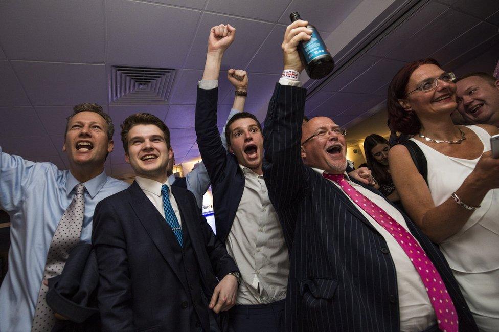 People react to a regional EU referendum result at the Leave.EU campaign's referendum party at Millbank Tower