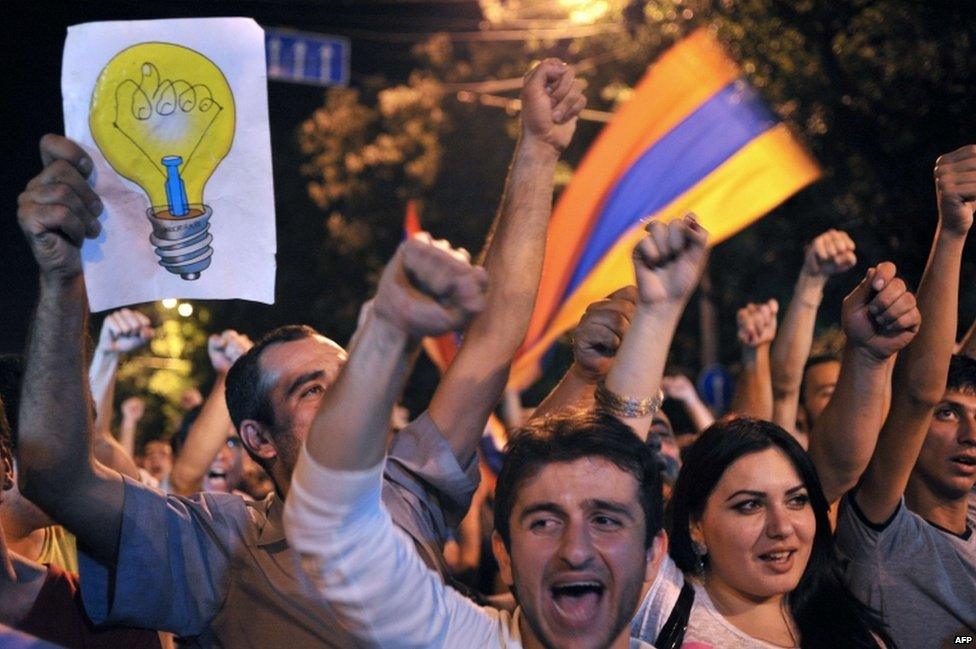 Protesters shout slogans during a demonstration against an increase of electricity prices in Yerevan early on 25 June 2015