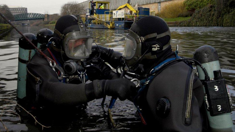 Divers searching for missing person