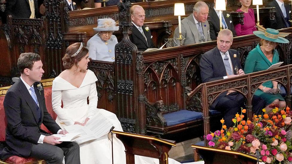 Princess Eugenie and Jack Brooksbank glance across the chapel at the Duke and Duchess of York