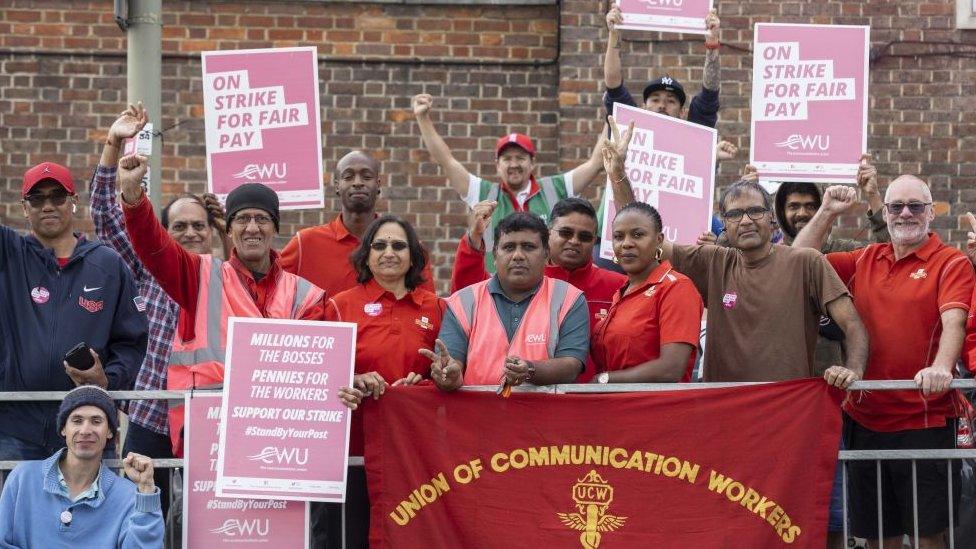 Communications worker union members on strike