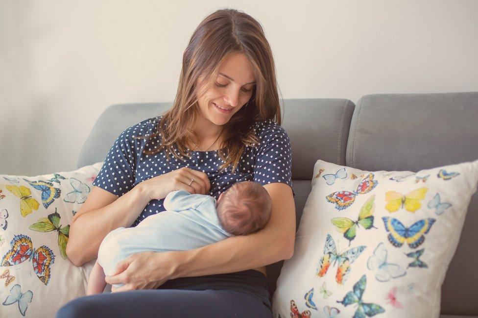 Mother breastfeeding baby