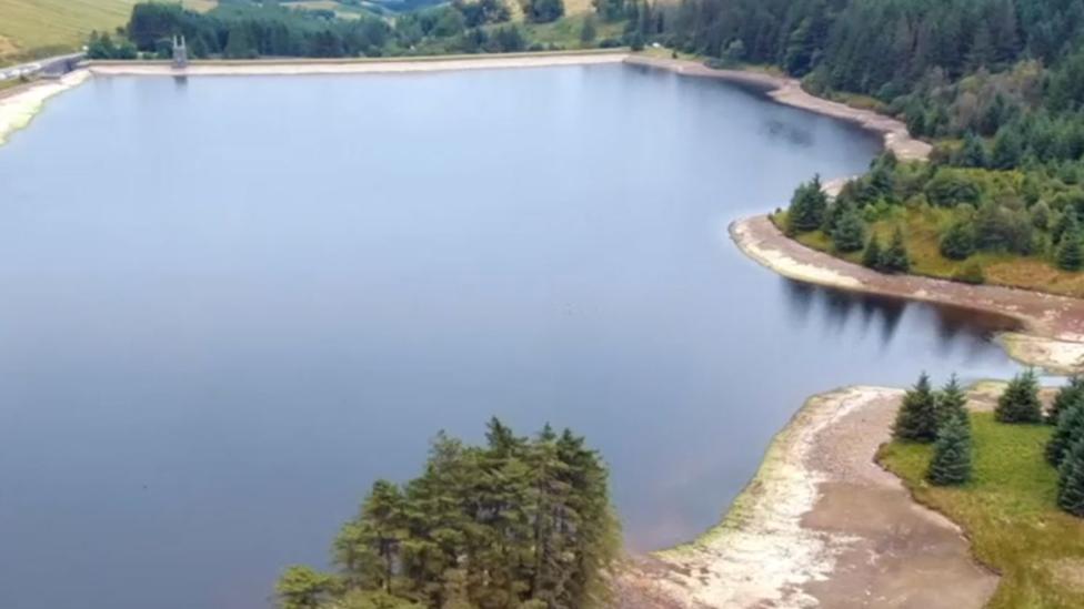 A half-empty Beacons Reservoir in the heatwave