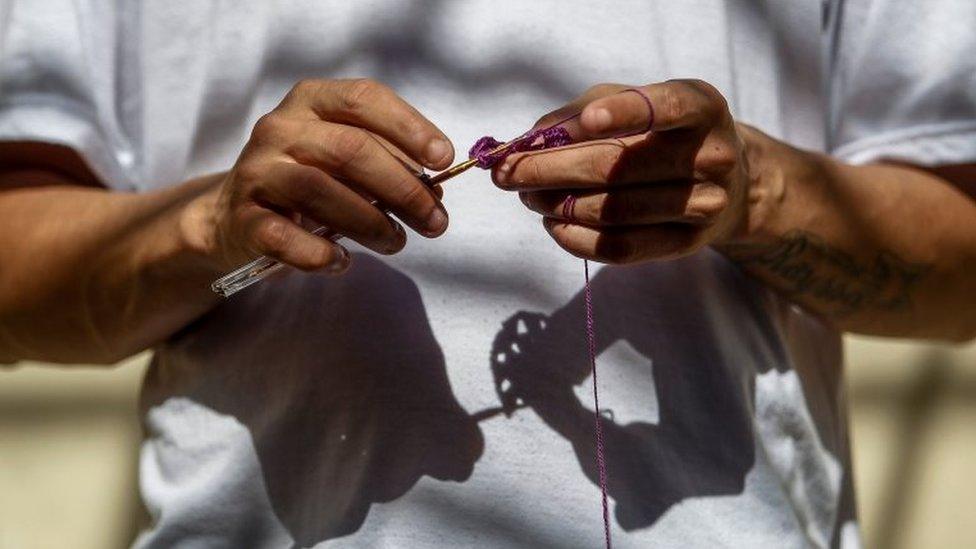 An inmate crochets clothing as part of "Ponto Firme" project in the Adriano Marrey maximum security penitentiary in Guarulhos, Brazil on May 22, 2019