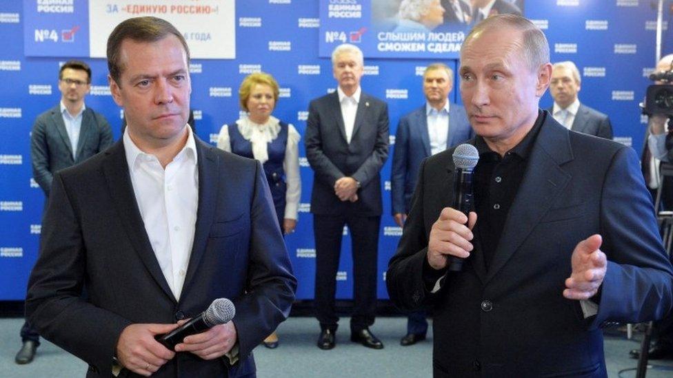 Dmitry Medvedev (L) and Vladimir Putin