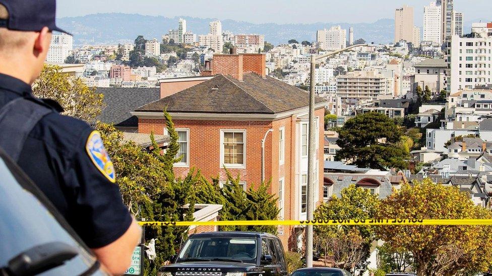 An officer stands guard near the Pelosi residence