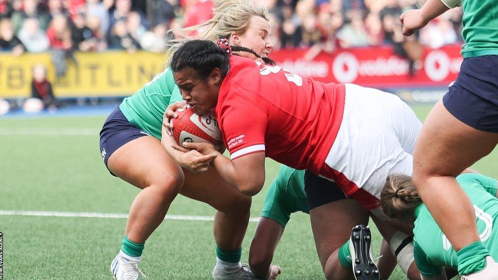 Sisilia Tuipulotu of Wales powers over to score