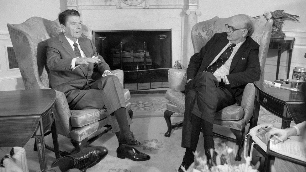 President Reagan talks with Federal Reserve Board Chairman Paul Volcker in the Oval office.