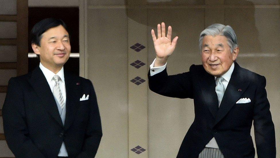 This file photo taken on 2 January 2015 shows Japan's Emperor Akihito (R) waving to well-wishers beside Crown Prince Naruhito during their new year greetings in Tokyo