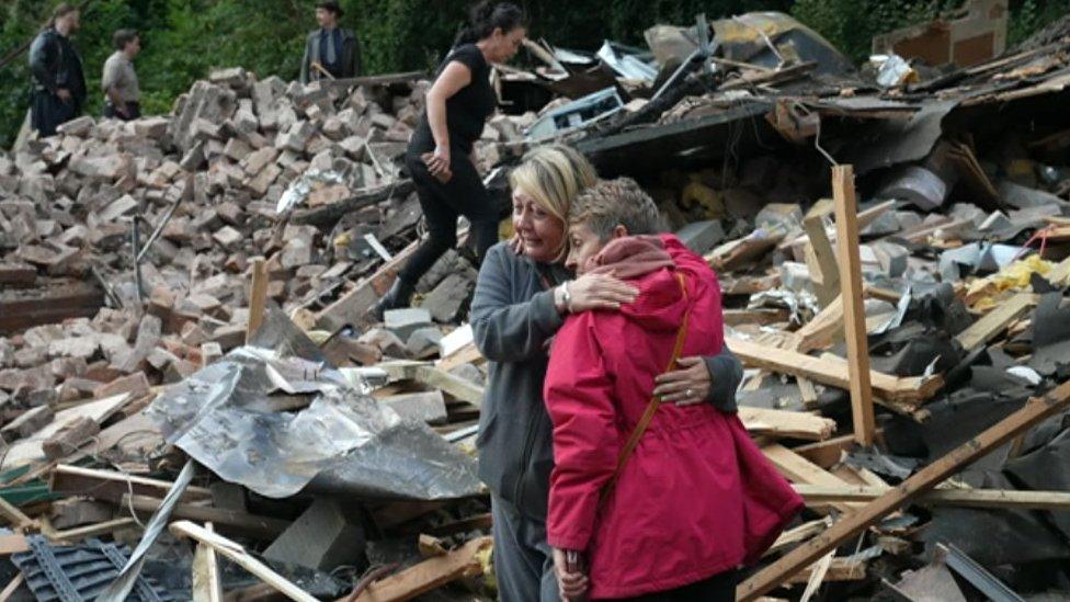 Campaigners at the site of the Crooked House ruins