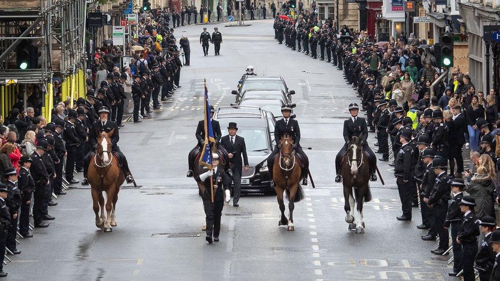 Cortege travels through the street