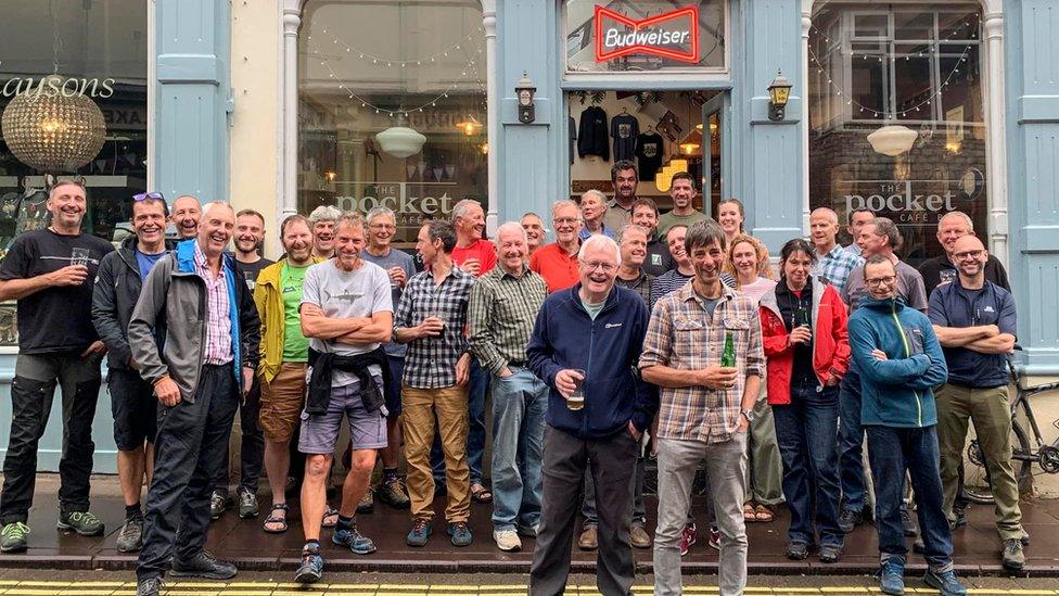 The team outside the bar