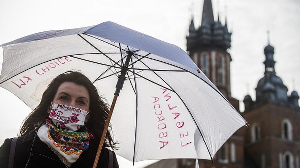 A pro-abortion activist takes part in a demonstration in Krakow in April 2020