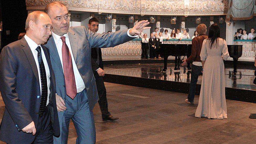 Russian President Vladimir Putin (L) listens to Valery Gergiev at the Mariinsky Theatre Valery Gergiev in 2013