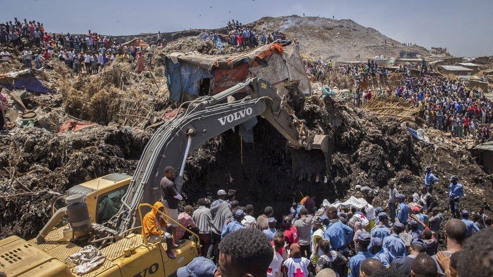 Rescuers work at the scene of a garbage landslide, on the outskirts of the capital Addis Ababa