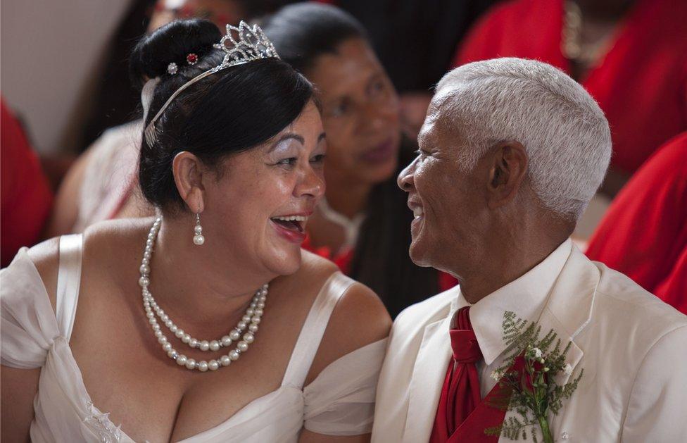 A couple laugh before their wedding on Valentine's day on Robben Island, near Cape Town, on 14 February, 2015.