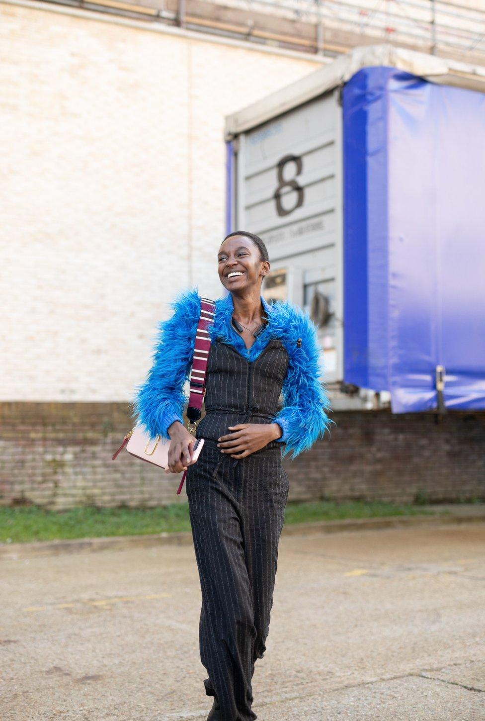 Model in a fluffy blue coat