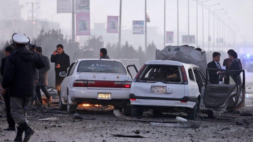 Afghan soldiers inspect the site of the suicide bombing in the diplomatic area of Kabul (20 January 2016)