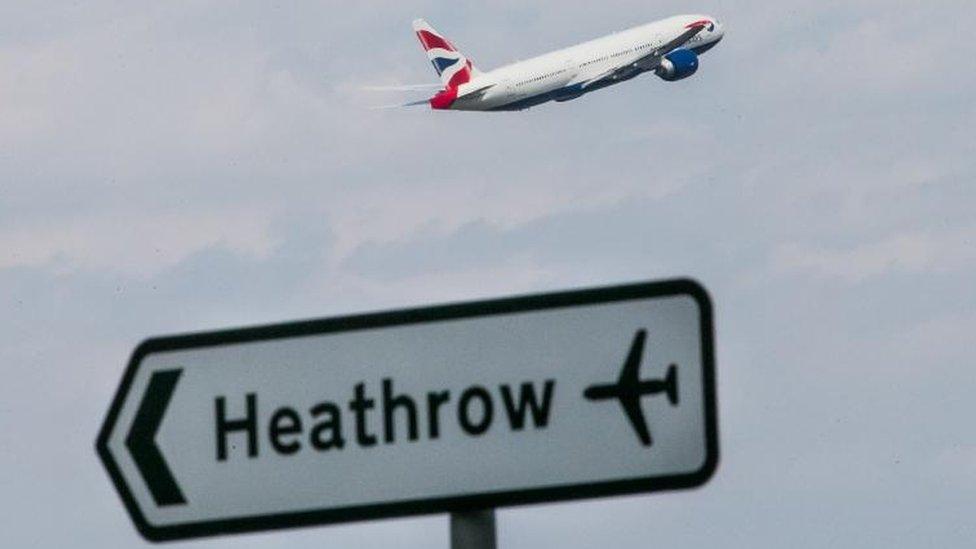 Plane taking off and Heathrow sign