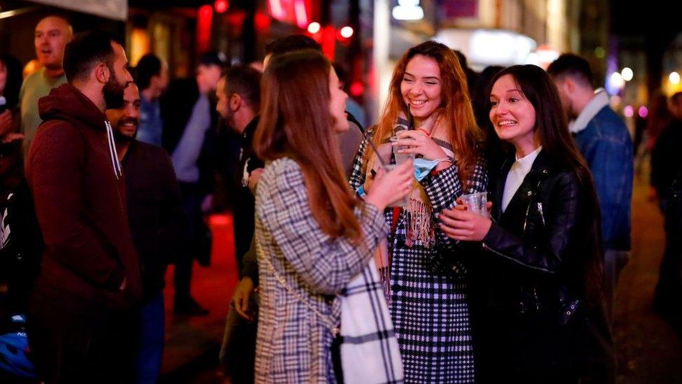 Revellers on the first evening of the 22:00 curfew