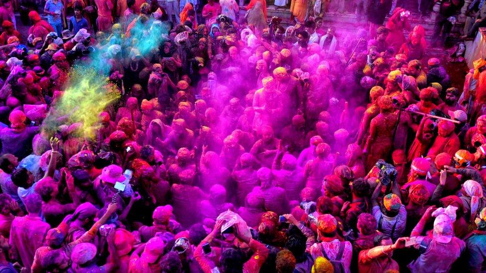 Hindu's are seen playing with colourful powders at the Radharani Temple of Nandgaon,