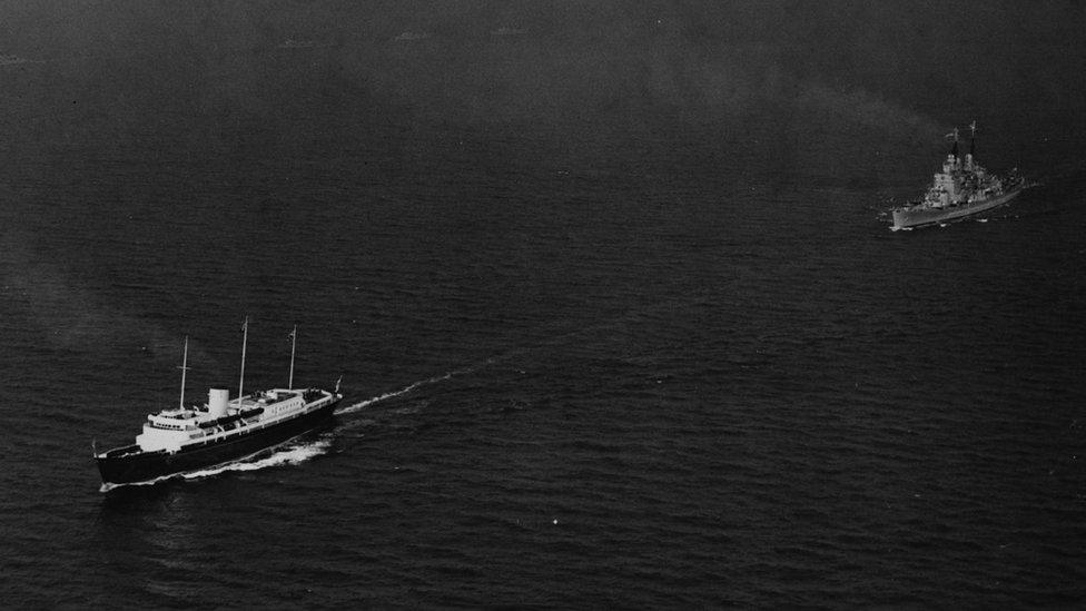 The Royal Yacht 'Britannia', which is carrying Queen Elizabeth II and the Duke of Edinburgh, is followed by the HMS Vanguard as it is escorted to the River Thames, near Plymouth, May 14th 1954