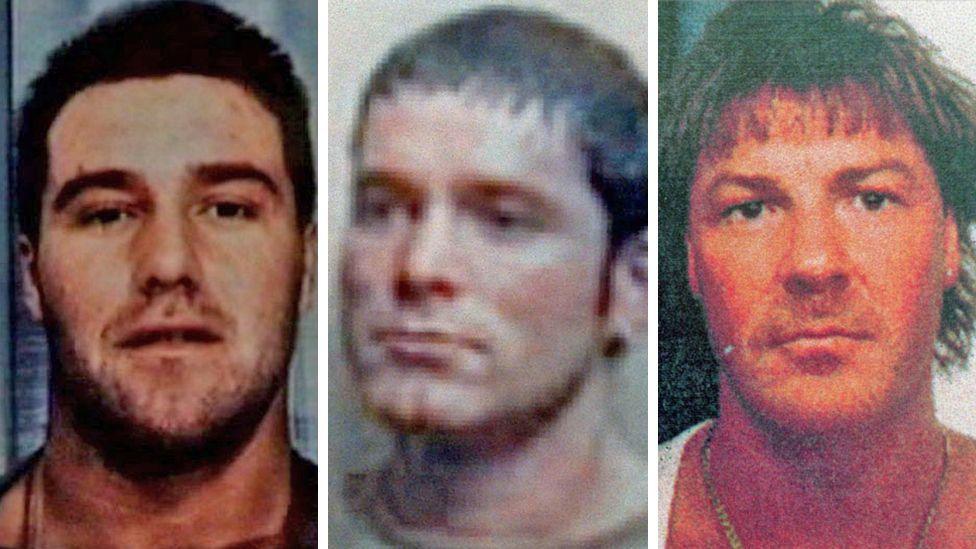 Left to right: Craig Rolfe, Tony Tucker and Pat Tate. Mr Rolfe appears to be in custody, appearing with dark hair and unshaven. Mr Tucker also has short dark hair and appears younger. Mr Tate has long dark hair and slight moustache.