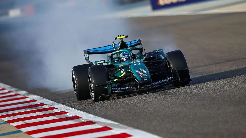 Fernando Alonso locks up in the Aston Martin on track during pre-season testing in Bahrain 