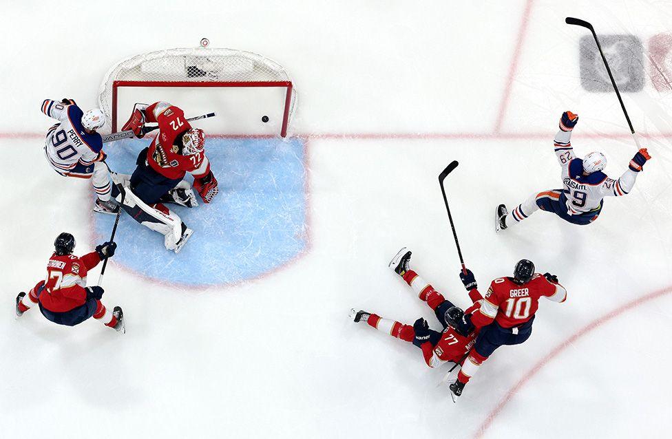 Edmonton Oilers' Leon Draisaitl scores the game-winning goal against Florida Panthers' Sergei Bobrovsky during overtime to win 5-4 in Sunrise, Florida. Photo by Steph Chambers