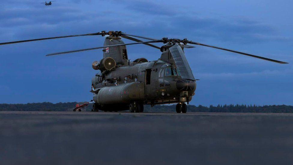 RAF Chinook on the runway at RAF Odiham as night falls 