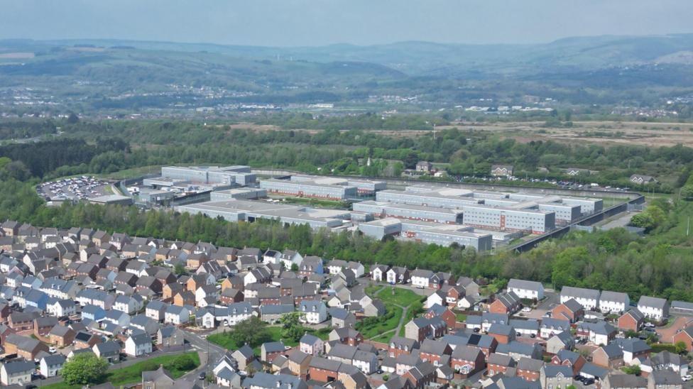 An aerial view of Parc prison with houses above