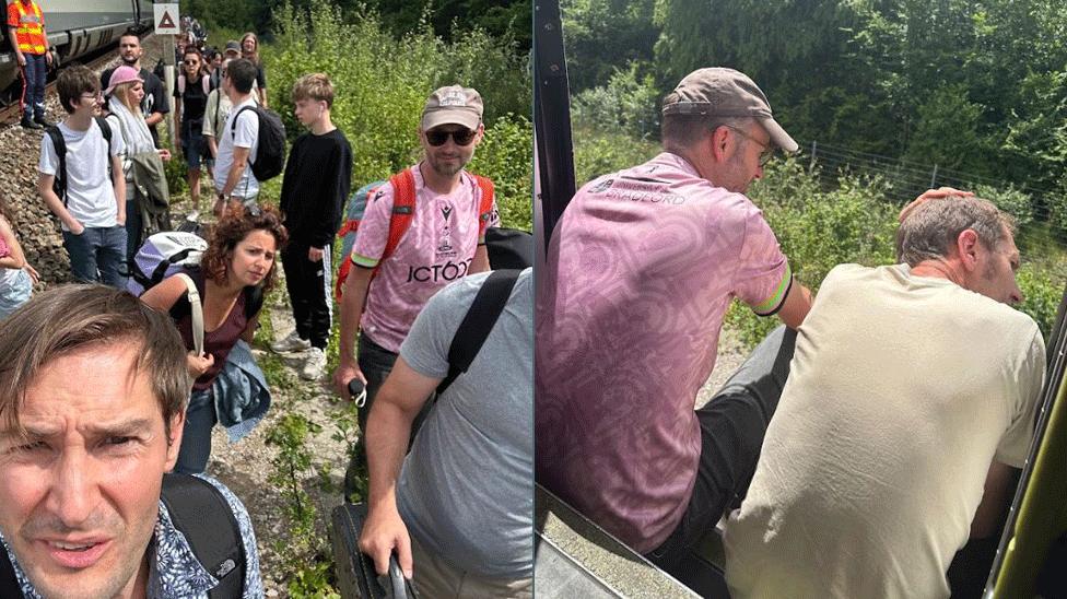 Oli takes a selfie as people wait outside the train. Other members of the band sit and wait.