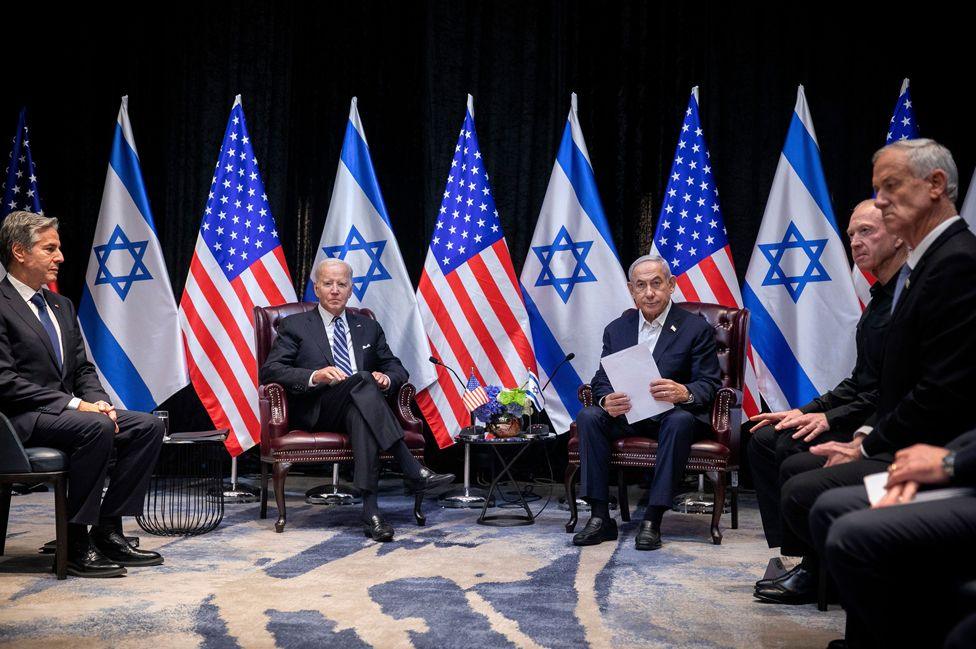 US Secretary of State Antony Blinken, US President Joe Biden, Israeli Prime Minister Benjamin Netanyahu, Israeli Defense Minister Yoav Gallant, and Benny Gantz, who is part of the new national emergency government look on during a meeting in Tel Aviv, Israel, on 18 October 2023